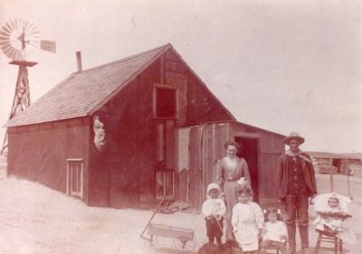 George Harvey Sisson & Orrie Braytonette Barton Sisson Homestead
This was shared by Tammy Jorgensen.

Homestead of George Harvey Sisson and Orrie Braytonette Barton Sisson.

Taken in 1911

The people in the picture are George Harvey Sisson, Orrie Braytonette Barton Sisson, Pearl, Lyle, Irene and Cliff Sisson. The family dog and Lyle's little wagon. A coyotes hide is hanging on the corner of the house. Later more was added on to the house. A bigger barn was also built and a chicken house and granary . Iva Sisson was born in this house and lived there until 1928/1929
